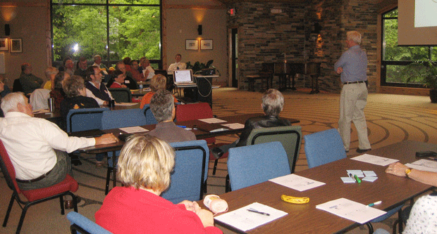 Men and Women participating in Governance Training indoors