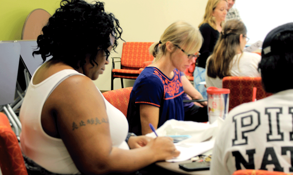 Woman taking notes during leadership retreat