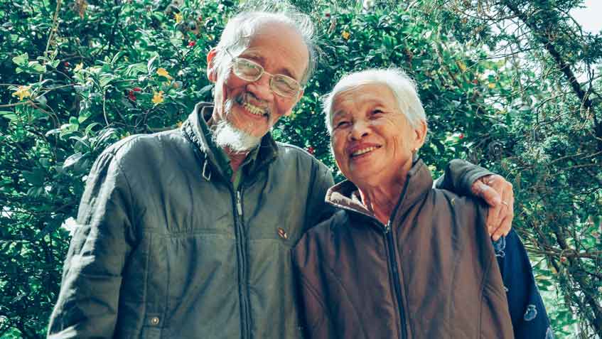 smiling-older-adults-outdoors Smiling man and woman outdoors