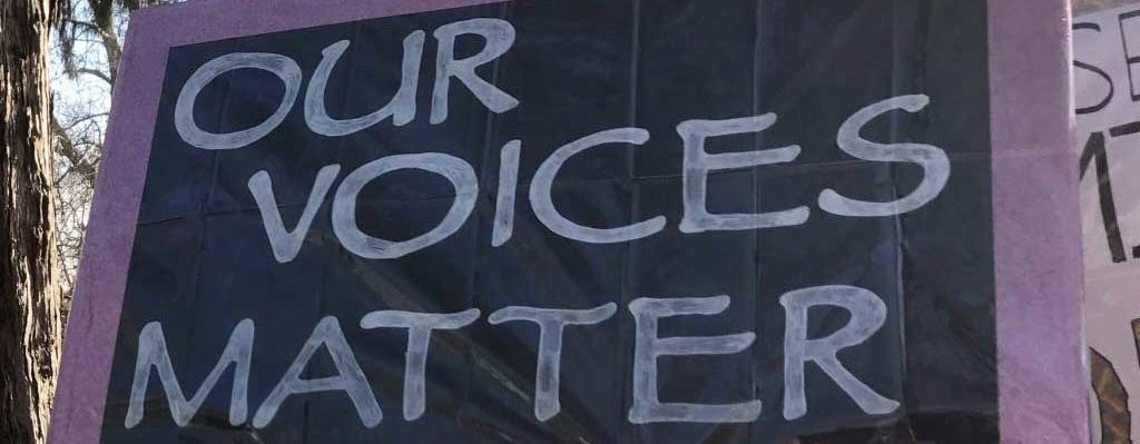 Protest sign reading Our Voices Matter